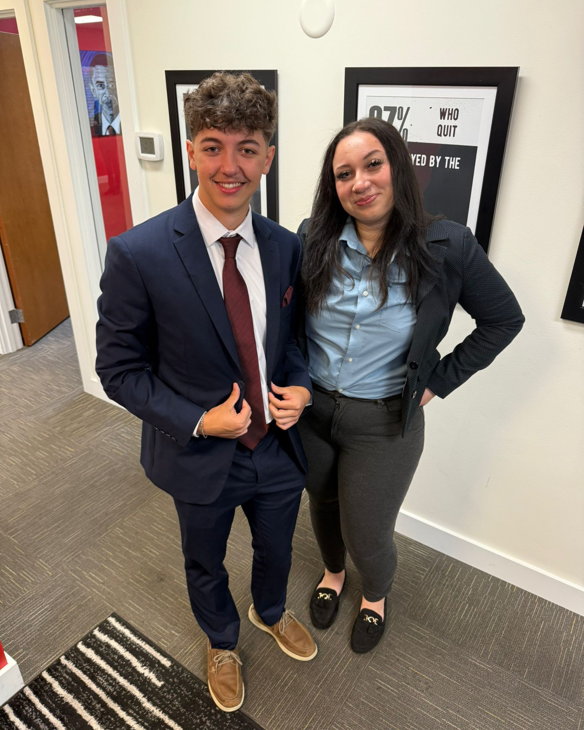 A new sales intern standing with a seasoned professional